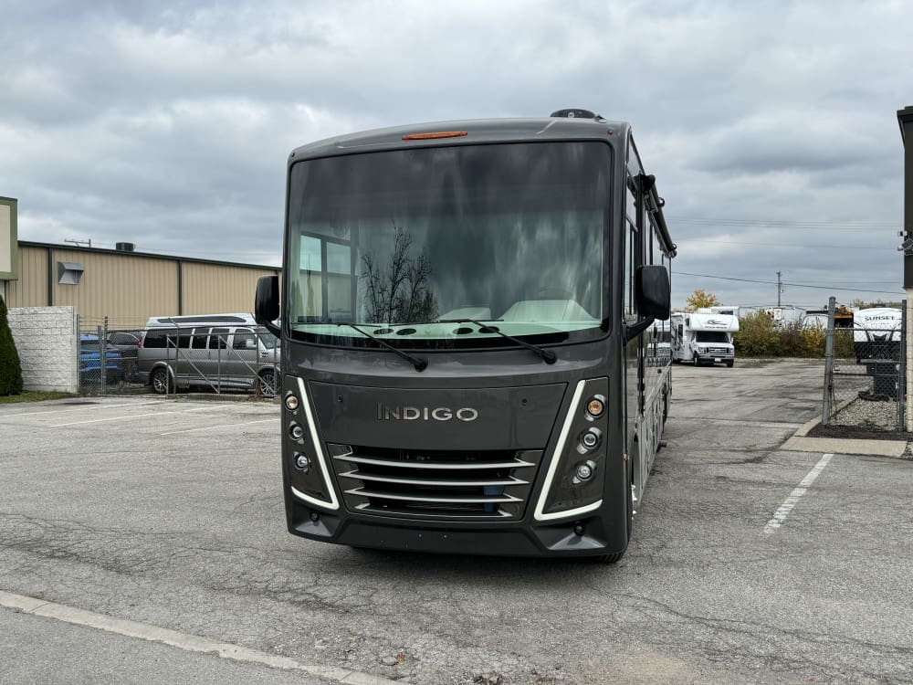 Modern RV under cloudy sky