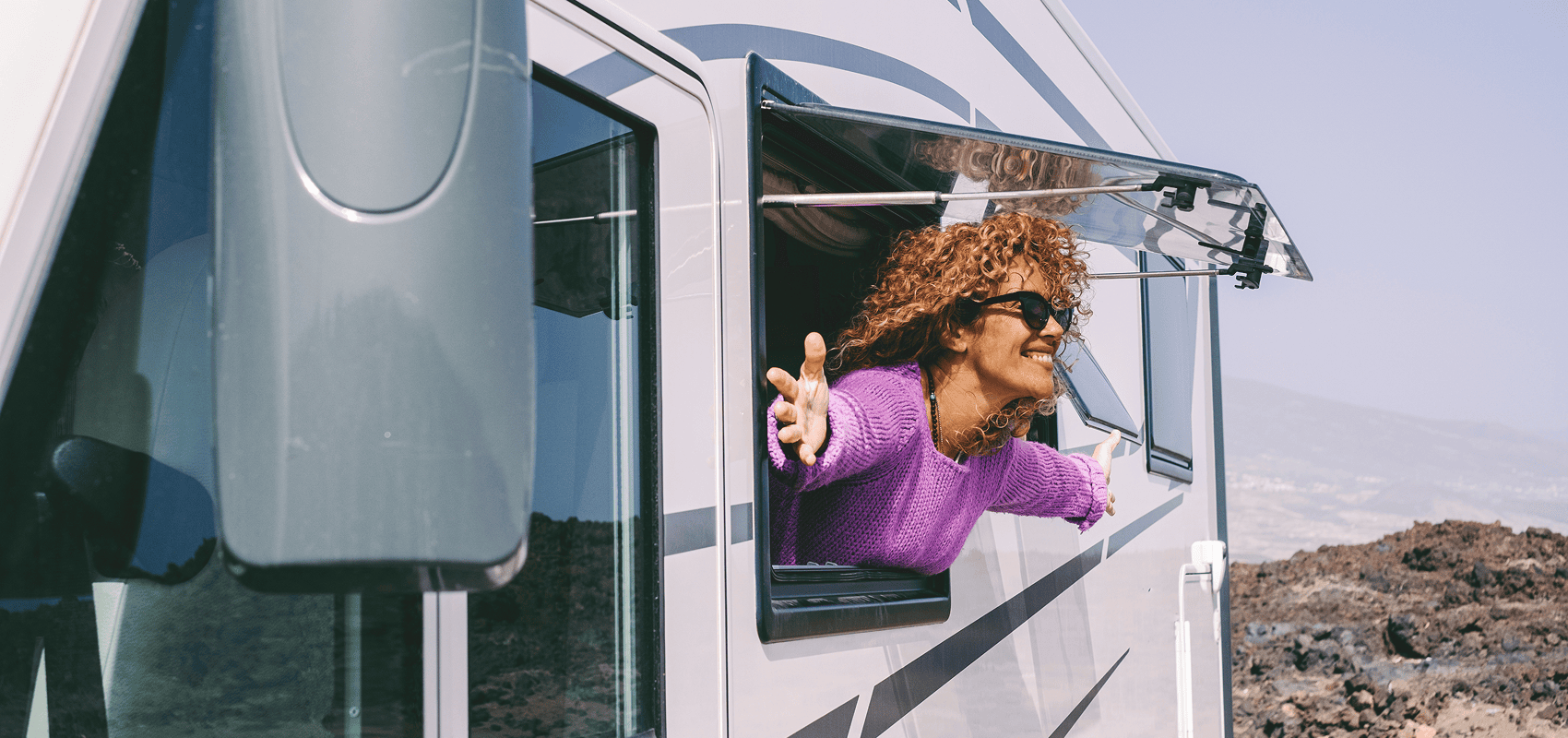 Happy traveler in camper van