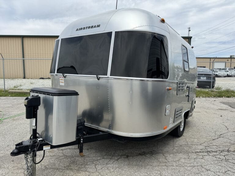 Compact Airstream camper on pavement
