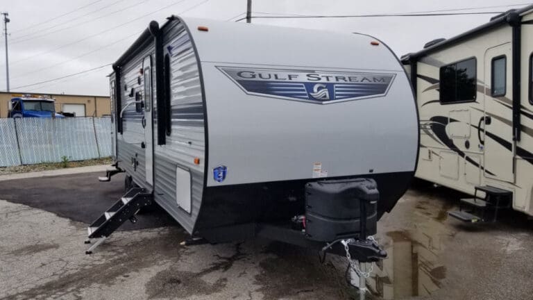 RV parked beside another camper