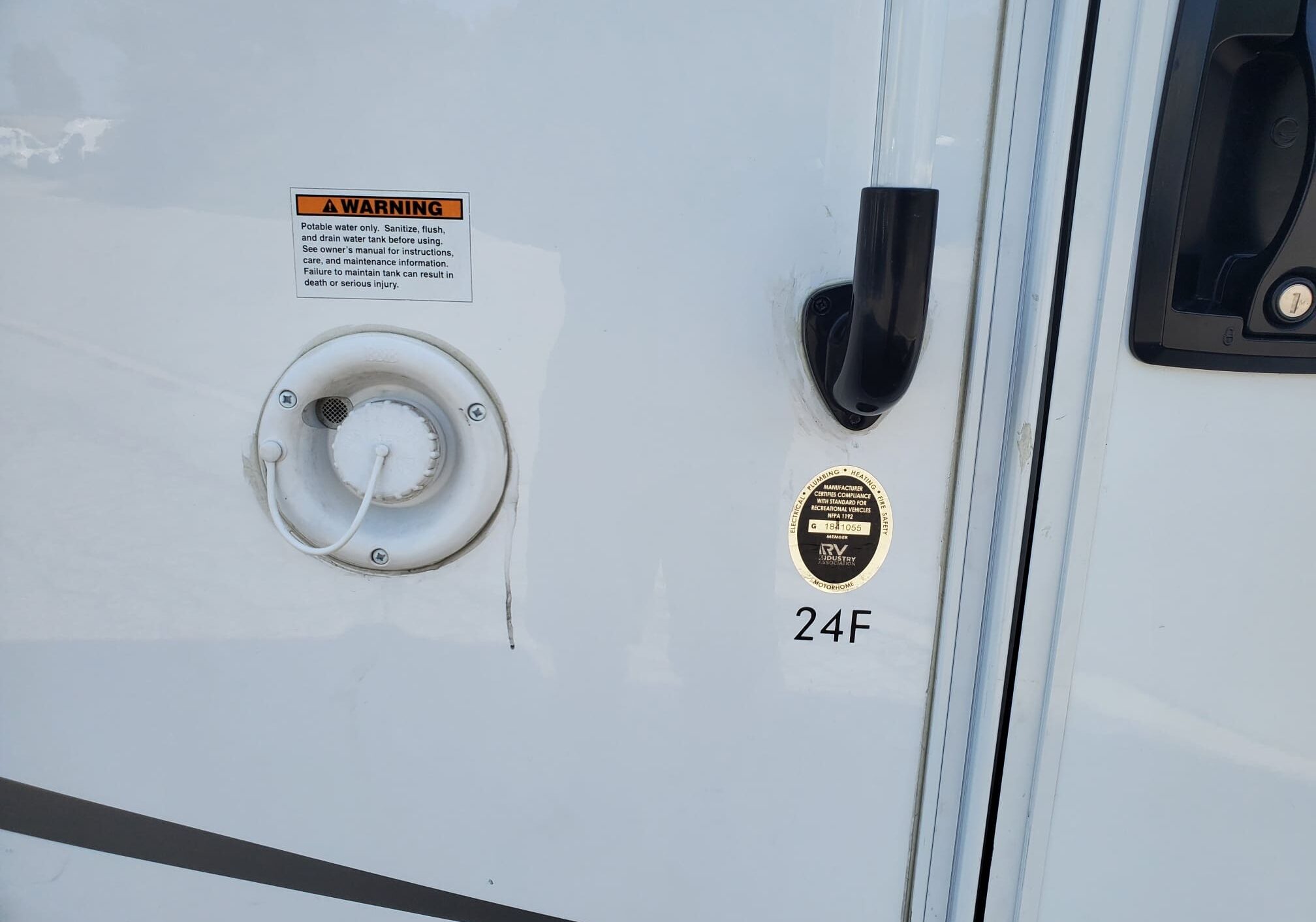 Motorhome utility port with label